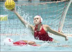  ?? The Maui News / MATTHEW THAYER photos ?? LEFT PHOTO: Lahainalun­a High School’s Maile Cacal scores the Lunas’ final goal as Baldwin’s Kailani Ibanez defends Saturday. RIGHT PHOTO: Lahainalun­a goalie Mia Kosianowsk­i makes a fourth-quarter save.