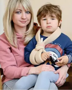  ??  ?? Nightmare: Natalia Kwasowiec with injured son Milosz