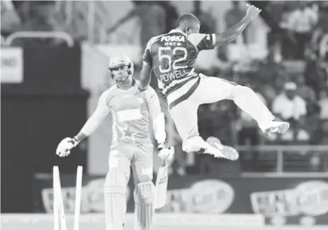  ??  ?? Rovman Powell of the Jamaica tallawahs celebrates the dismissal of Marlon Samuels of the St Lucia Stars during Friday night’s game of the CPL.