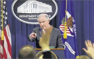  ?? SUSAN WALSH / ASSOCIATED PRESS ?? Attorney General Jeff Sessions, at a news conference Thursday, says he met the Russian ambassador in his role as a member of the Senate Armed Services Committee, not as a Trump adviser with the campaign, and that his confirmati­on hearing answers were...
