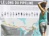  ?? FREDERIC HORE / POSTMEDIA NEWS FILES ?? A map of the proposed Energy East pipeline is displayed at a rally organized by Greenpeace in Hudson, Que.