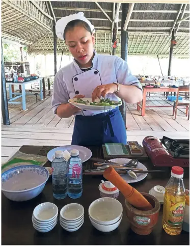  ?? — Photos: ANN MARIE CHANDY/The Star ?? Vui, our affable guide and cooking instructor, taking us through the paces of making four different and very delicious Vietnamese dishes.