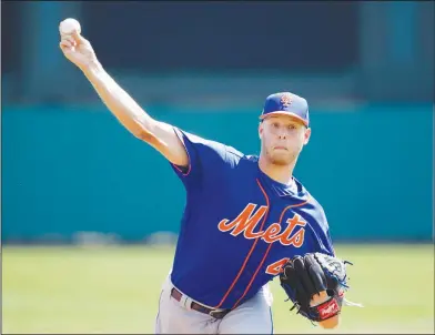  ?? Associated Press ?? Bringing the heat: New York Mets starting pitcher Zack Wheeler throws in the first inning of a spring training game on Friday in Kissimmee, Fla.