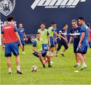  ?? — ABDUL RAHMAN EMBONG / The Star ?? Keeping it light: Johor Darul Ta’zim players during a training session at the Padang Seri Gelam in Johor Baru yesterday.