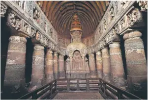  ??  ?? This chaitya griha or prayer hall (above) can be traced to the fifth century AD. The hall has painted depictions of Buddha in various poses.