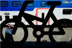  ??  ?? A Berlin S-Bahn carriage sporting a bicycle sign made by Swiss rail giant Stadler is on display at Innotrans, the railway industry’s largest trade fair, in Berlin. — AFP photo