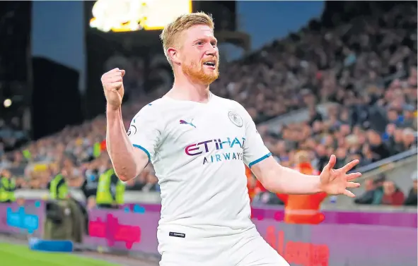  ?? ?? Kevin De Bruyne celebrates after taking his goal tally to 15 for the season and maintainin­g City’s three-point lead over Liverpool.