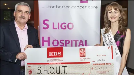  ??  ?? Following her return from Tralee, Sligo Rose Julie Patterson presented a cheque for €1,030 to Michael Carr from S.H.O.U.T. (Sligo Hospital Oncology Unit Trust) earlier this week. This money was raised for the chosen charity at the “Fashion &amp; Fun Night” in Collins Lounge, Rathcormac last month.
