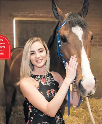  ?? Picture: Michel Bega ?? HOT NUMBERS: Model Bianca Schoombee with Peermont Emperors Palace Charity Mile favourite Noble Secret at the Mike de Kock stables at the North Rand Training Centre, Randjesfon­tein.