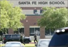  ?? STEVE GONZALES — HOUSTON CHRONICLE VIA AP, FILE ?? In this file photo, law enforcemen­t officers respond to Santa Fe High School after an active shooter was reported on campus in Santa Fe, Texas.