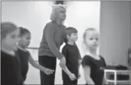  ?? PHOTOS COURTESY OF JOE RYAN ?? Elena Martinson with student Rocky Rochlin at the Dance Internatio­nal Studio in West Pottsgrove. The studio, which opened in February, offers ballet classes for dancers of all levels.