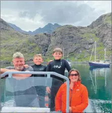  ??  ?? Tim and Gill Vollum with their sons Rory and Olly. The couple are taking on the Kerrera marina lease.