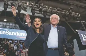  ??  ?? Former Democratic presidenti­al candidate Sen. Bernie Sanders, I-Vt., accompanie­d by Rep. Alexandria Ocasio-Cortez, D-N.Y., takes the stage Feb. 10 at campaign stop at the Whittemore Center Arena at the University of New Hampshire in Durham, N.H.
(File Photo/AP/Andrew Harnik)