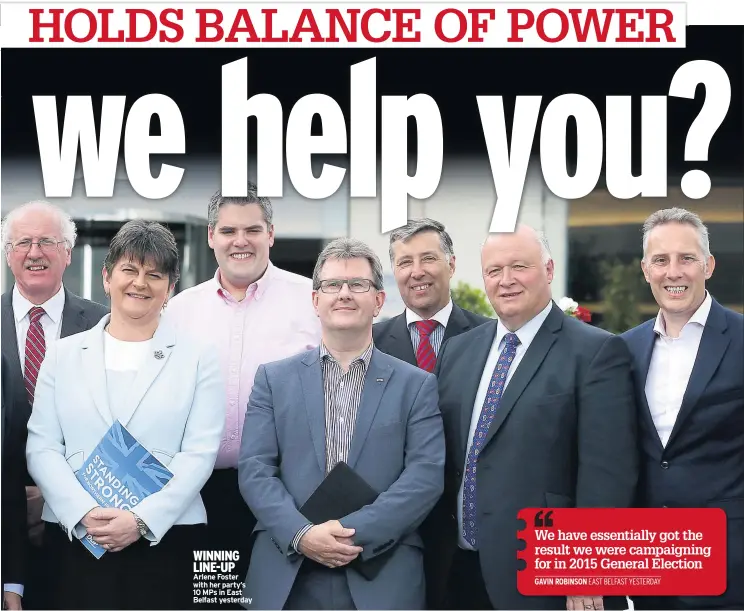  ??  ?? WINNING LINE-UP Arlene Foster with her party’s 10 MPS in East Belfast yesterday