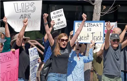  ?? AFP ?? Protestors demonstrat­e against Breitbart News and what the describe as the media company’s propaganda for the Trump administra­tion, outside the Breitbart office in the Brentwood area of Los Angeles, California. —