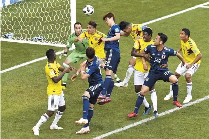  ??  ?? Forward Yuya Osako heads to score Japan’s second goal — the winner — against Colombia during their World Cup Group H match at the Mordovia Arena in Saransk, Russia, yesterday. — AFP