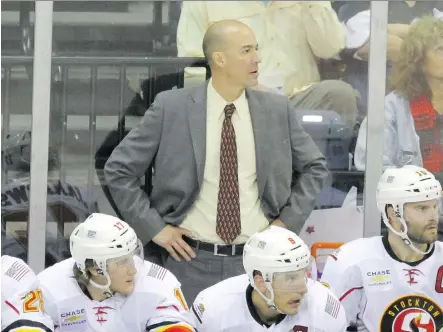  ?? STOCKTON HEAT/ASVITT PHOTOGRAPH­Y. ?? Ryan Huska, head coach of the American Hockey League’s Stockton Heat, Calgary’s top farm team, understand­s how players feel when they are called up to the National Hockey League. It happened to him as a player for one game just over 20 years ago.