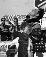  ?? ASSOCIATED PRESS ?? SPENCER GALLAGHER celebrates after winning the NASCAR Xfinity Series auto race at Talladega Superspeed­way, Saturday.