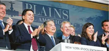  ?? Plains All American Pipeline LP ?? Executives with Plains All American Pipeline LP celebrated the company’s 20th anniversar­y by ringing the bell of the New York Stock Exchange in November.
