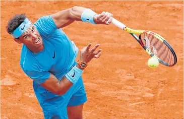  ?? REUTERS ?? Spain’s Rafael Nadal in action against Italy’s Simone Bolelli in the first round of the French Open yesterday.