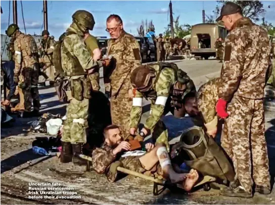  ?? Pictures: REUTERS, EAST2WEST NEWS & EPA ?? Uncertain fate... Russian servicemen frisk Ukrainian troops before their evacuation