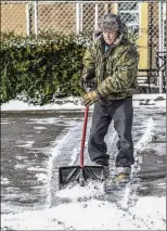  ?? GREG EANS/THE MESSENGER-INQUIRER VIA AP ?? Jimmy West, 77, spent part of his Friday clearing snow from an Owensboro, Kentucky, parking lot.