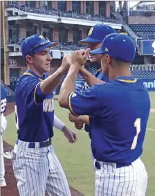  ?? KARINA LOPEZ PHOTO ?? Members of the Brawley Union High baseball team come together before the start of their game against Southwest High at Petco Park on Friday night.