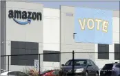  ?? JAY REEVES — THE ASSOCIATED PRESS FILE ?? A banner encouragin­g workers to vote in labor balloting is shown Tuesday at an Amazon warehouse in Bessemer, Ala.