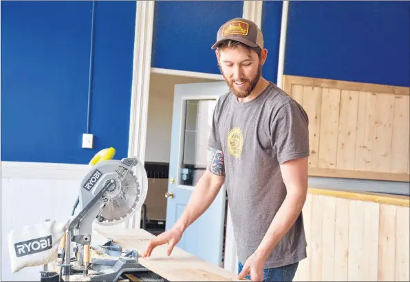  ?? COLIN CHISHOLM ?? Tony Wood is hard at work getting his new store, a combinatio­n of instrument repair and bicycle rentals, up and running in time for March.