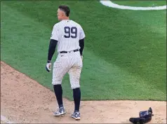  ?? Kathy Willens / Associated Press ?? The Yankees’ Aaron Judge walks away after striking out and stranding two runners during the ninth inning of Thursday’s loss to the Blue Jays.