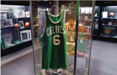  ?? The Associated Press ?? ■ The 1969 game worn jersey of Boston Celtics’ legend Bill Russell is displayed along with other memorabili­a set to go up for auction, Dec. 9, 2021, in Boston. Russell’s No. 6 jersey is being retired across the NBA. The league and the National Basketball Players Associatio­n made the announceme­nt Thursday permanentl­y retiring the number worn by the 11-time champion, civil rights activist and someone good enough to have been enshrined in the Basketball Hall of Fame as both a player and a coach. He died on July 31 at the age of 88.