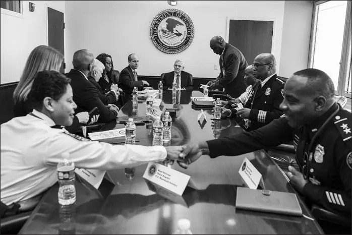  ?? KENNY HOLSTON / THE NEW YORK TIMES ?? U.S. Attorney General Merrick Garland meets with local law enforcemen­t officers March 17 at the Justice Department’s office in Atlanta.