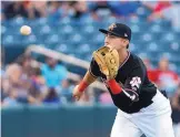  ?? GREG SORBER/JOURNAL ?? Albuquerqu­e shortstop Daniel Castro readies to field a ground ball and throw out El Paso’s Threll Jenkins at first base in Tuesday night’s game at Isotopes Park. At bat Castro went 3-for-4.