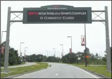  ?? Associated Press ?? GOING TO DISNEY WORLD — A sign at the entrance to ESPN’s Wide World of Sports at Walt Disney World is seen Wednesday in Kissimmee, Florida. The National Basketball Players Associatio­n unanimousl­y agreed to NBA’s 22-team plan for restarting the season at Disney.