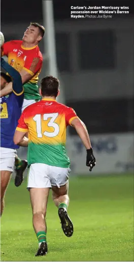  ?? Photos: Joe Byrne ?? Carlow’s Jordan Morrissey wins possession over Wicklow’s Darren Hayden.