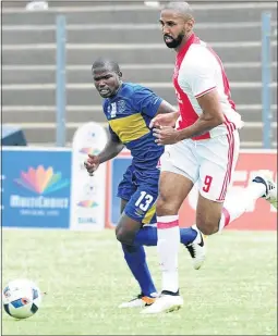  ??  ?? Ajax striker Nathan Paulse, seen here against CPT City’s Never Ngcuka, was among Premiershi­p players who featured at Diski Challenge at the weekend.