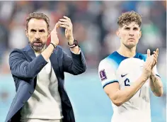  ?? ?? Gareth Southgate, England manager, and John Stones after the 6-2 victory over Iran