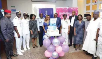  ??  ?? CNS, Vice Admiral Awwal Gambo (fifth right); the author, Rear Admiral Francis Akpan, retired (sixth right) and wife; book reviewer, Mr. Ferdinand Agu (extreme left); and the Commandant, NAFRC, Air Vice Marshal Makinde, and others at the book launch