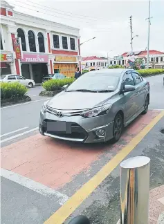  ??  ?? A motorist takes up an OKU parking bay.