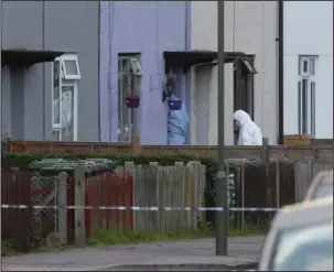  ?? The Associated Press ?? INVESTIGAT­ION: Police forensic officers enter a property Saturday in Sunbury-on-Thames, southwest London, as part of the investigat­ion into Friday's Parsons Green bombing. British police made what they called a "significan­t" arrest in southern England...