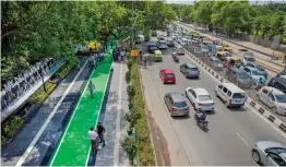  ?? — PTI ?? An 800-metre stretch of redesigned road under inspection in New Delhi on Saturday. The Delhi government will redesign and beautify 540 km-long roads in the national capital according to European standards.