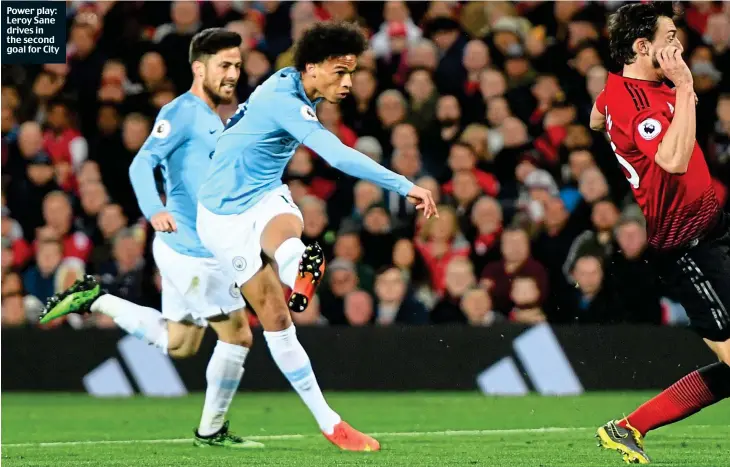  ??  ?? Power play: Leroy Sane drives in the second goal for City
