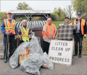  ?? SYLVIA JACQUARD ?? Members of the Lions Club and of the community worked together recently to clean up the litter on Hwy 358 from the Cornwallis River to Hwy 1. Flanking the garbage they picked up are community members Ralph and Linda Pietersma and Lions Club members Brian Tupper, Dave Seaboyer and Keith Simpson.