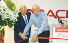  ?? (Ezra Levy) ?? US AMBASSADOR to Israel David Friedman cuts a ribbon with Oracle Israel country leader Uzi Navon at the groundbrea­king for the firm’s office complex in Petah Tikva yesterday.