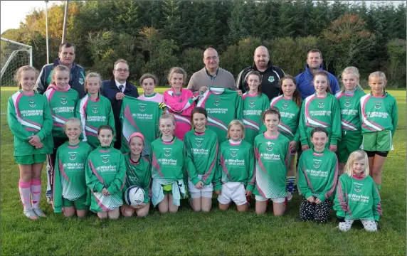  ??  ?? Ultan Ryan for Wexford Credit Union and Dave Dempsey for Coillhaven Building and Carpentry Ltd. presented jerseys to the Forth Celtic under-age girls on Wednesday evening. The girls are pictured with trainers Dave O’Brien, Wayne Gregg and John Quirke,...