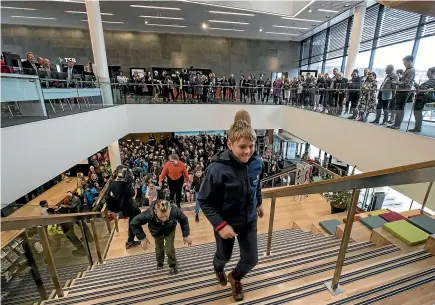  ?? PHOTOS: IAIN MCGREGOR/STUFF ?? Luke Watts, 10, was the first member of the public up the stairs at the official opening of Tu¯ ranga, the central city library, in Christchur­ch yesterday.