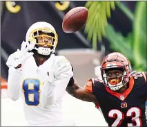  ??  ?? Los Angeles Chargers’ Mike Williams (81) makes a catch against Cincinnati Bengals’ Darius Phillips (23) during the first half of an NFL football
game on Sept 13 in Cincinnati. (AP)