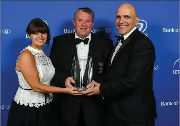  ??  ?? Bert Nicholson, President, Wicklow RFC, accepts the award on behalf of Wicklow RFC for the Bank of Ireland Junior Club of the Year, from SharonWood­s, Bank of Ireland and President of Leinster Rugby Niall Rynne.