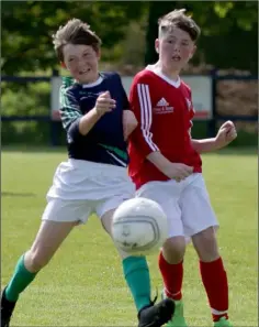  ??  ?? Jamie Pepper (Moyne Rangers) tussles with Josh Cooney (Forth Celtic).