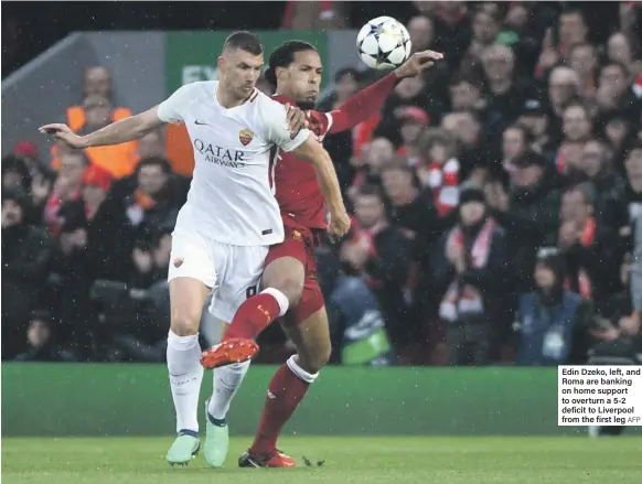  ?? AFP ?? Edin Dzeko, left, and Roma are banking on home support to overturn a 5-2 deficit to Liverpool from the first leg